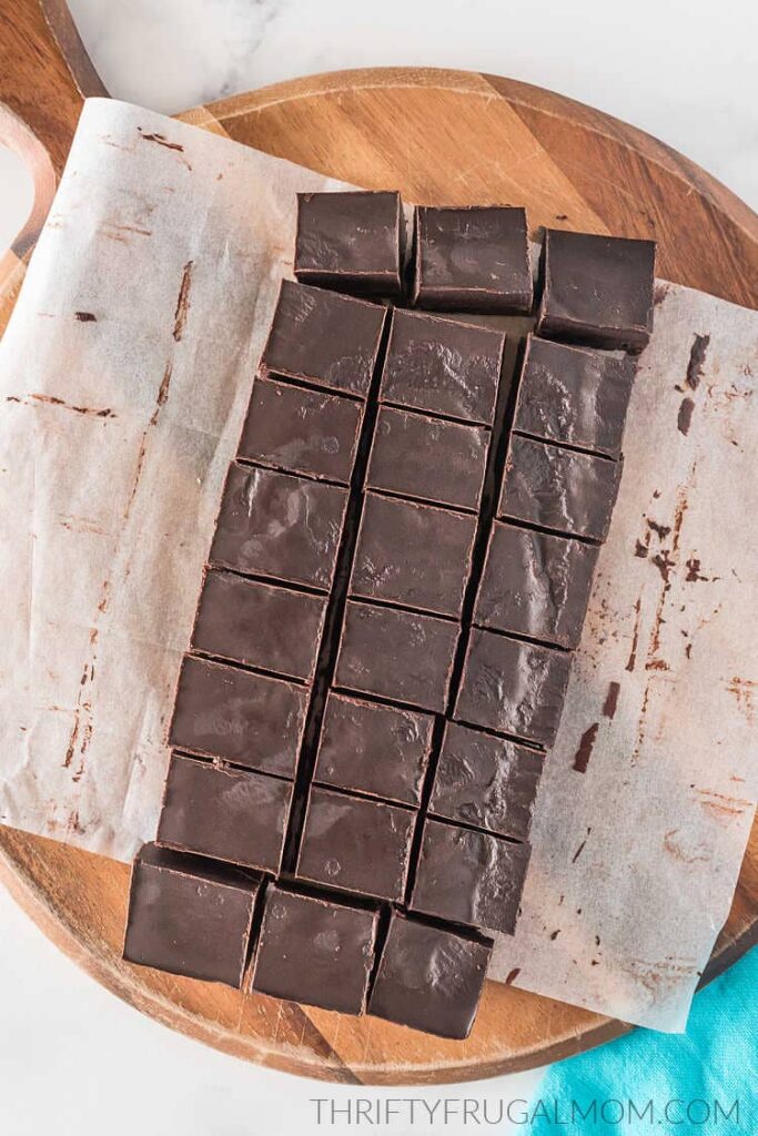 squares of healthy 3 ingredient coconut oil fudge on cutting board 