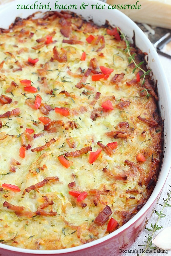 zucchini bacon and rice casserole in a red baking dish