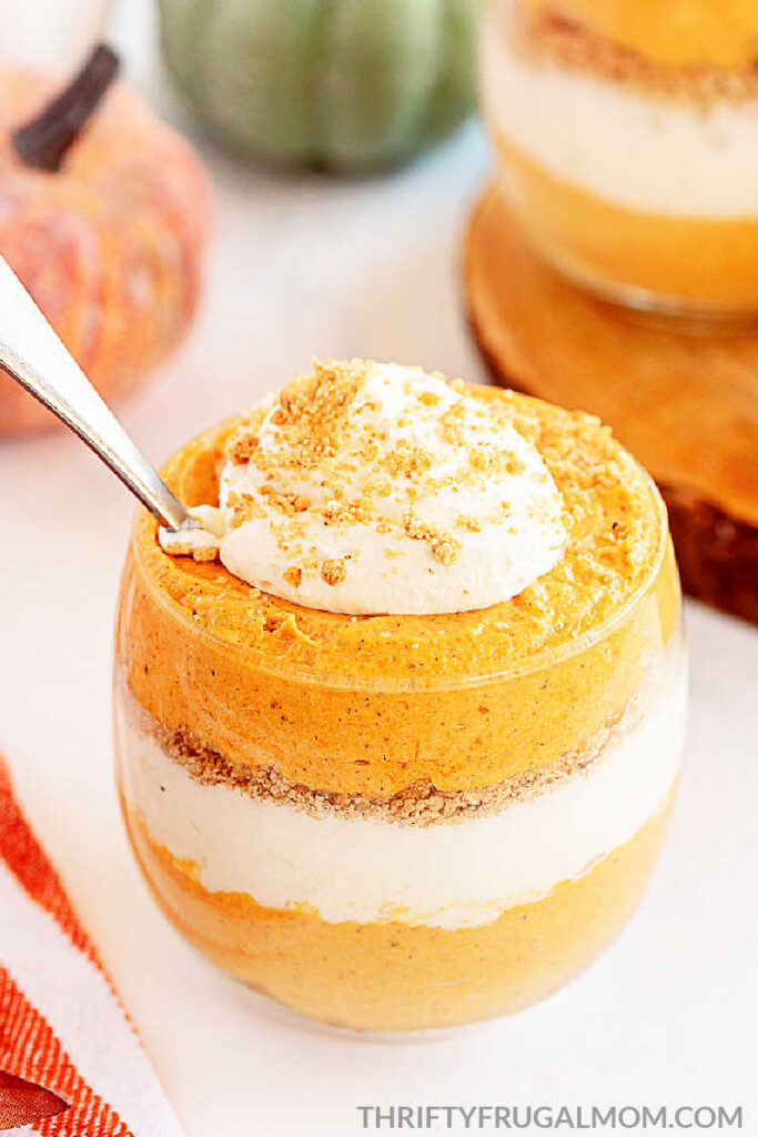 No Bake Pumpkin Cheesecake Trifle in a glass with a spoon