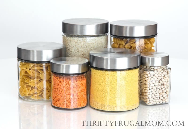 glass jars full of dried beans, lentils, rice and pasta
