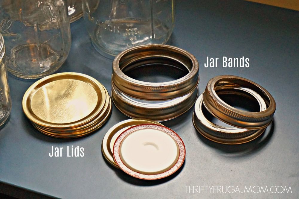 various size canning jar lids and jar bands on a gray countertop