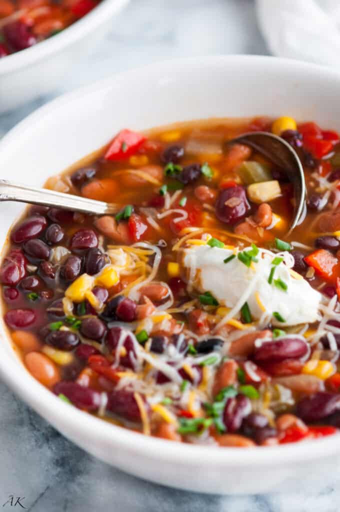 a white bowl full of meatless three bean chili