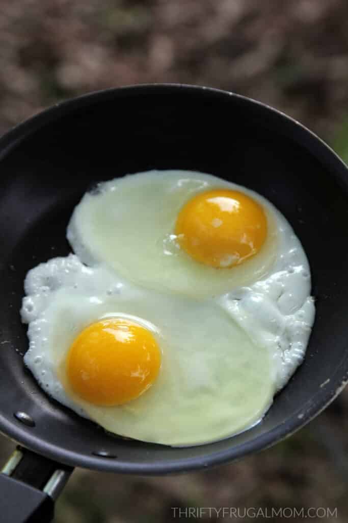 eggs being fried in bacon fat