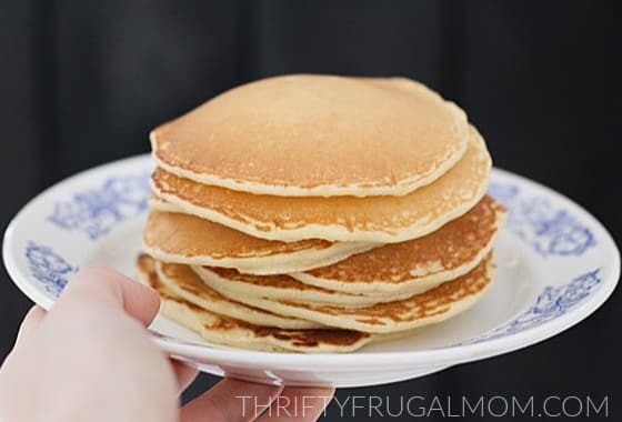 a stack of pancakes on a plate- made using leftover bacon grease
