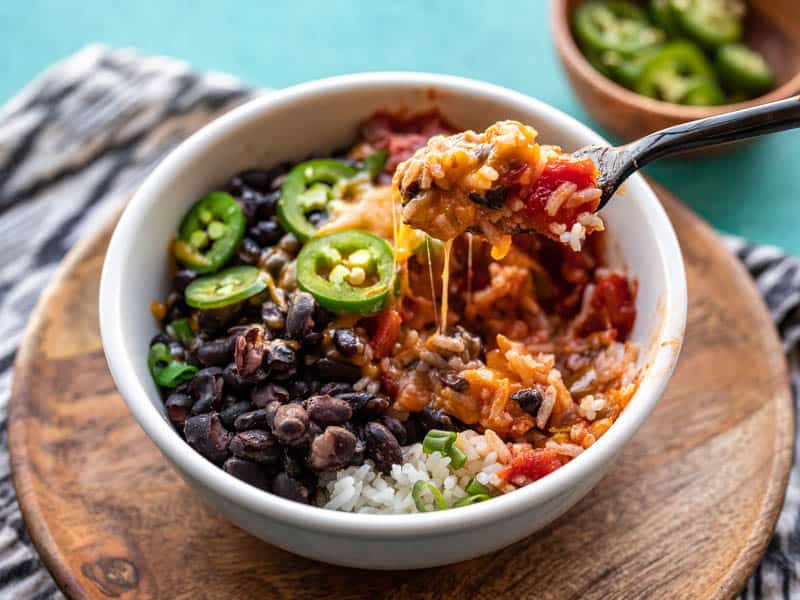 poor man's burrito bowl recipe in a white dish on a wooden platter