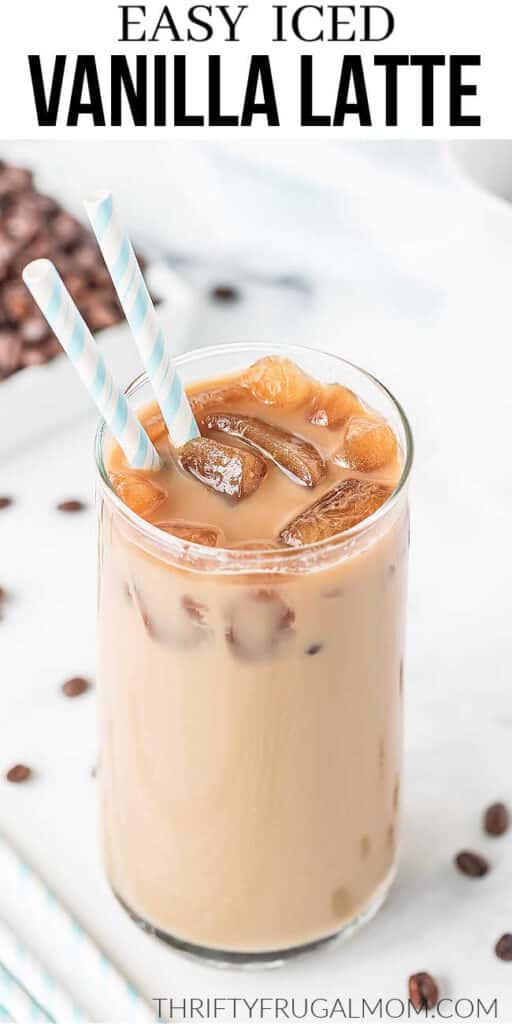 a homemade iced vanilla latte in a glass with two paper straws with text overlay