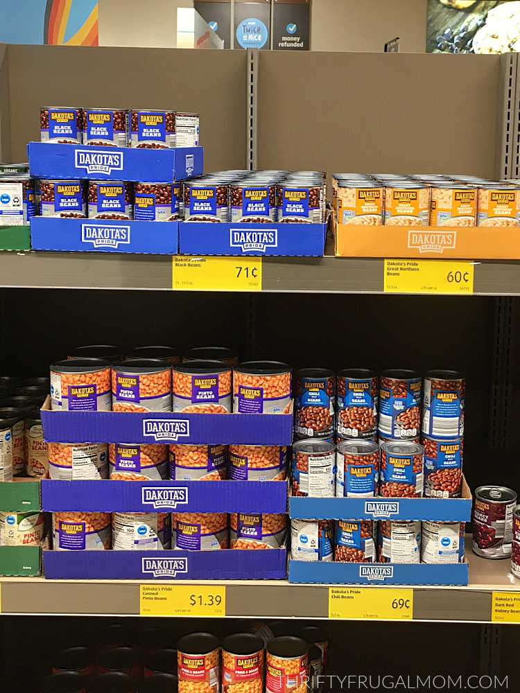 cans of various kinds of beans on shelves at Aldi
