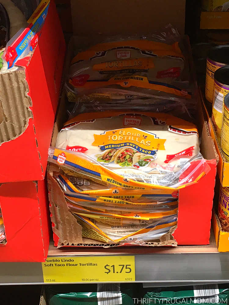 a box full of flour tortillas on a shelf at Aldi
