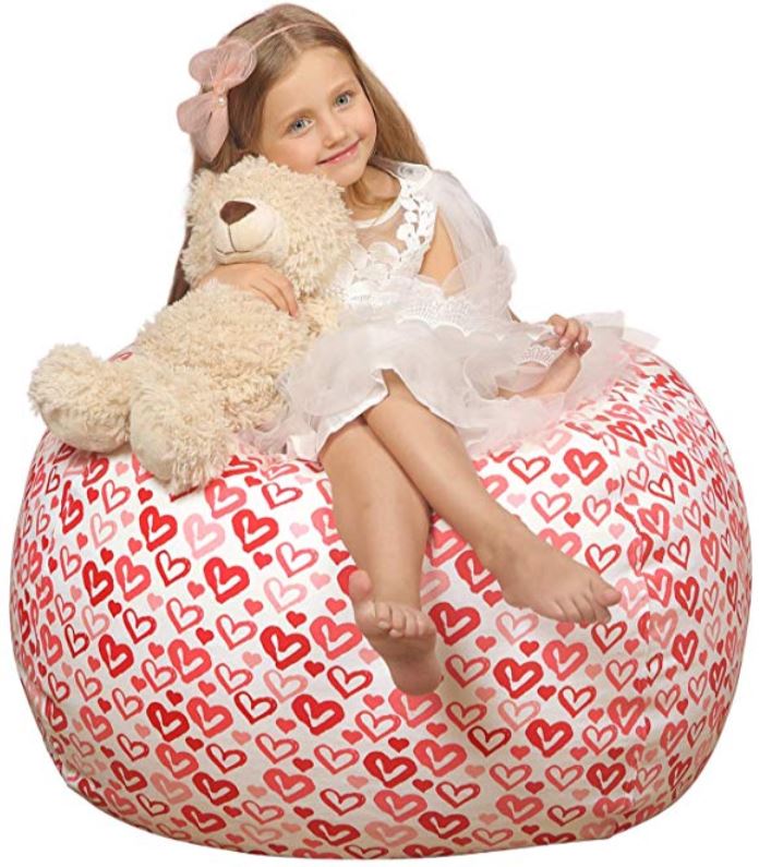 a bean bag with a little girl sitting on it.