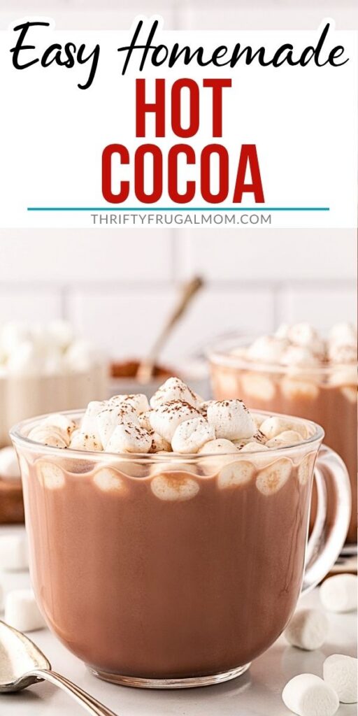 Homemade hot cocoa topped with marshmallows in a clear glass mug, with Pinterest graphic reading “Easy Homemade Hot Cocoa.”